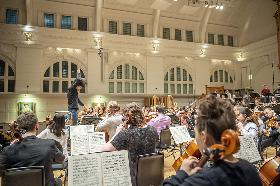 Payare conducting an orchestral rehearsal at the RCM